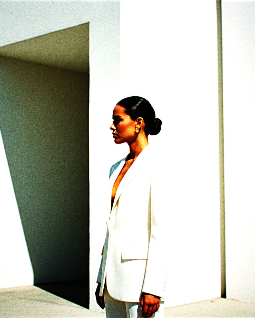 METHOD H L.A. — Structural white blazer against brutalist concrete architecture, Los Angeles fashion house, Study 01 Look 001